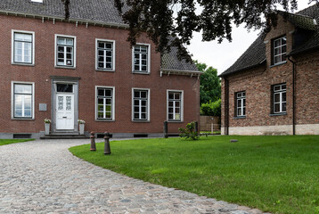 Sint Blasius Boekel, Zwalm, Belgium - Parsonage house in traditional brick stone with front garden