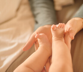 Hands, baby feet and home in bedroom, newborn and family for love, care and nurture. Bonding,...
