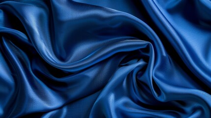 Obraz premium Silky satin fabric in a royal blue shade brings a smooth and luxurious texture to your background.