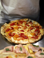 freshly baked artisanal mozzarella and tomato pizza