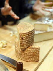 wedges of artisanal sheep's cheese cured at the market
