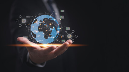 A man is holding a globe in hand that with network connection lines, dots and analysis graph in concept of AI analysis technology, innovation and worldwide business transformation.