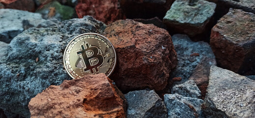 Cryptocurrency golden coins - Bitcoin lies on the background of a stone texture