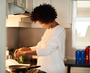 Breakfast, cooking and egg with black woman in kitchen of home for diet, health or nutrition. Food,...