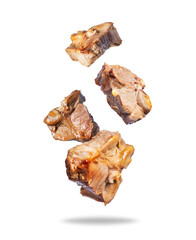 Fried beef steaks close up in the air isolated on a white background