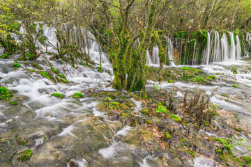 Autumn view of the waterfall. Jiuzhaigou nature reserve. Jiuzhai Valley National Park.