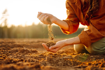 Hand of expert farmer collect soil and checking soil health before growth a seed of vegetable or...