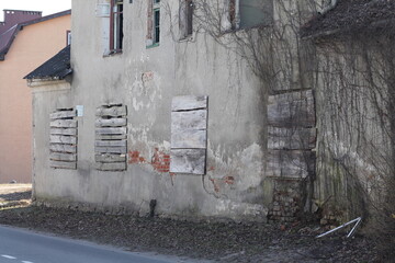 old abandoned building with boarded up windows