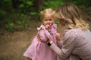 In the calm of the forest, a mother and child share a secret. Portrays a nurturing bond and the...