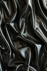 A close-up of a silky black fabric with luxurious, smooth waves creating a sumptuous, sophisticated texture