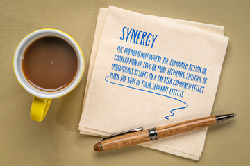 definition of synergy phenomenon. note on a napkin, collaboration, integration and teamwork concept