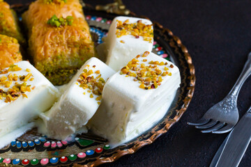 Traditional Turkish Maras Cut Ice Cream, designed with baklava on a round copper plate