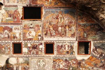 Windows and colorful frescos on the front facade of the Rock Church at the Sumela, Sümela...