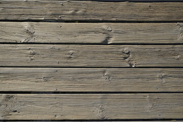 Wood texture. Street boards. The surface of the pier near the water. Deck