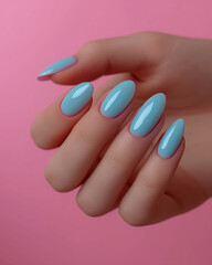 Close up delicate manicure, nails covered with nail polish pastel gently blue color on pink background