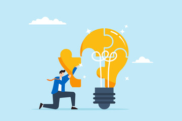 Smart businessman solving lightbulb idea puzzle by connecting last jigsaw piece, illustrating problem solver. Concept of find solutions, overcome difficulties through ideas, creativity, and innovation