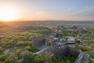 Landscape of Rohtas fort during sunset. Rohtas fort gate on the green hill.