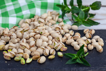 Pile of roasted pistachio. Healthy snack, vegetarian food full of protein, beer snack..