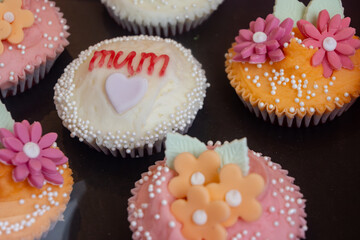 Colorful marzipan almongs cakes with decorative marzipan flowers