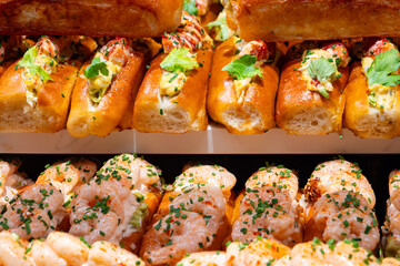 Fresh baked brioche buns filled with eggs, truffles, crab meat and shrimps ready to eat in food...