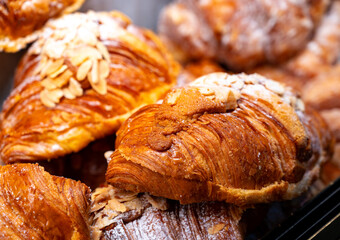Fresh baked pastries for breakfast, almond croissant with almond cream filling