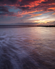 Blyth Beach, Northumberland, England, UK.  Sunrise sea view. Morning light over beach.