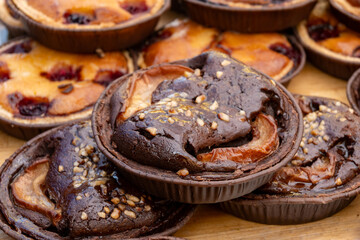Sweet pastries, rustic apple cakes, cherry, almond cakes on food market in London, UK