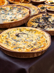 Tasty vegetarian food, french quiche savoury tart with leek onion and cheddar cheese and mushrooms