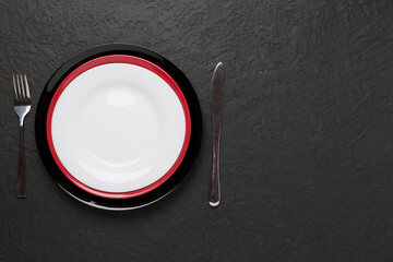 Minimal table setting on concrete background, top view