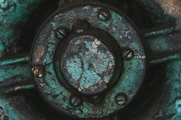 rust, peeled paint, on old weathered iron hub