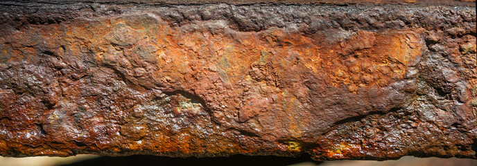 Rust on iron bar with brown and orange color.Corrosive grunge rusted on old iron.Pattern grunged...