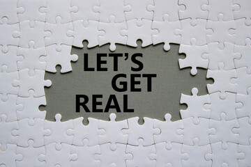Lets get real symbol. Concept words Lets get real on white puzzle. Beautiful grey background....