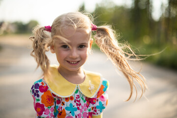 portrait of a girl, blonde, child happy and laughing, Ukrainian girl, happiness, hairstyle two...