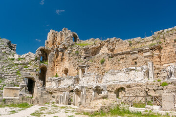 Picturesque ruins of an amphitheater in the ancient city of Perge, Turkey. Perge open-air museum.