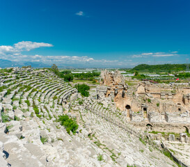 Picturesque ruins of an amphitheater in the ancient city of Perge, Turkey. Perge open-air museum.