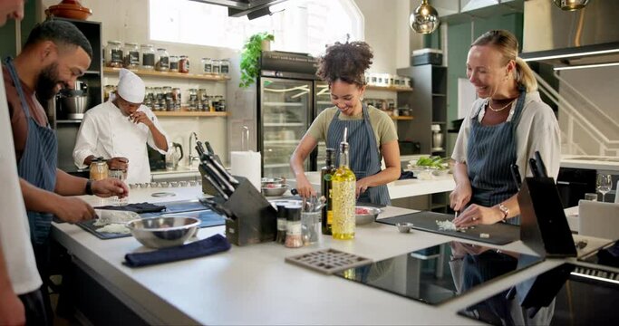 Chef, cooking class and cutting in kitchen for learn, teacher and food for professional skills. Restaurant, friends or culinary student with onion, vegetables and prepare with recipe cuisine teaching