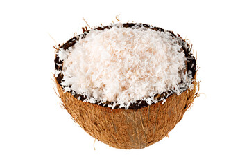 Coconut flakes poured into half of a fresh coconut isolated on a white background. Full depth of field. Close-up
