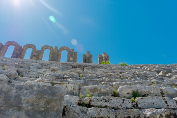 Picturesque ruins of an amphitheater in the ancient city of Perge, Turkey. Perge open-air museum.