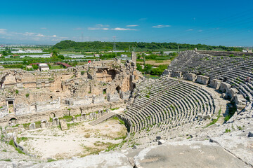 Picturesque ruins of an amphitheater in the ancient city of Perge, Turkey. Perge open-air museum.