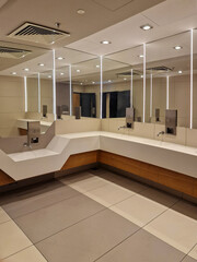 modern interior of a public restroom with washbasin for children