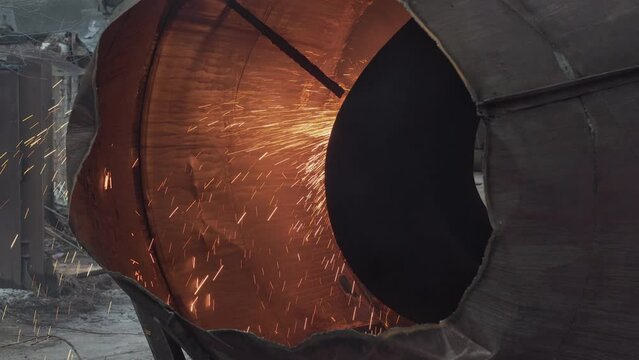 Lots of sparks from an old rusty turbine. Broken engine from an old spaceship. Concept of post-apocalyptic.