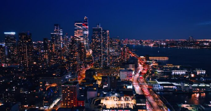 Breath-taking scenery of dazzling New York at night. Illuminated metropolis with lively traffic from drone footage.