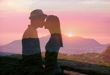 Romantic couple kissing in the sunset.	