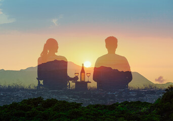 A romantic couple on a picnic sits in a together at sunset. Romantic getaway, summer holiday travel concept
