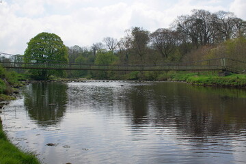 Suspension Bridge over the River Wharfe at Hebden Hippings (below Hebden) in Wharfedale, North Yorshire, England, UK