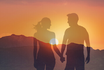 Man woman walking holding hands at sunrise smiling in love, people relationship love