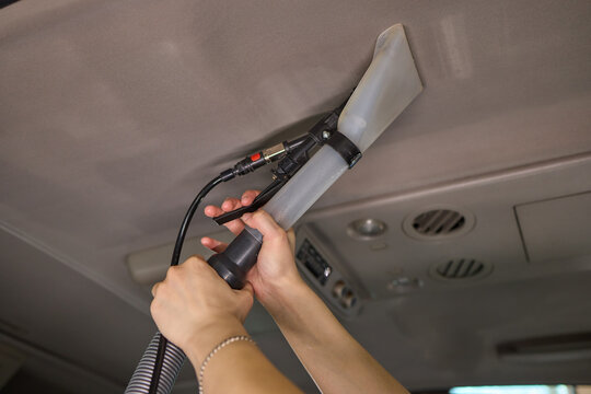 Carwash service, cleaning of car ceiling covering