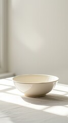 An empty ceramic bowl sits on a white tablecloth in front of a white background. AI.