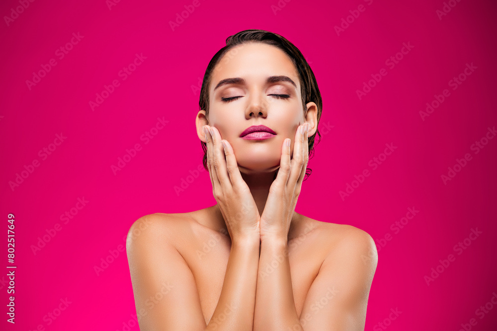 Wall mural photo of attractive young woman touch face skincare routine closed eyes shoulders off isolated on pi