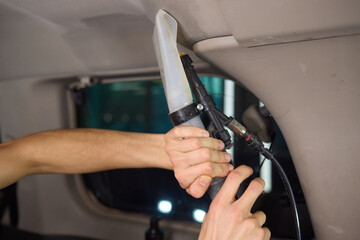 Carwash service, cleaning of car ceiling covering